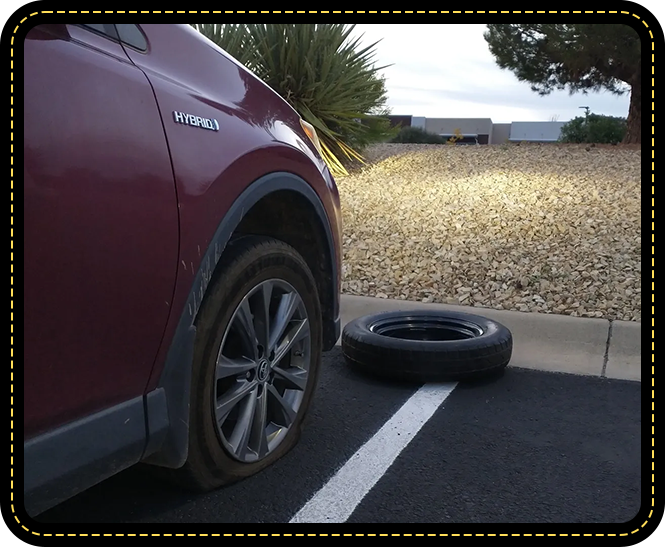 A car that has been hit by an automobile tire.