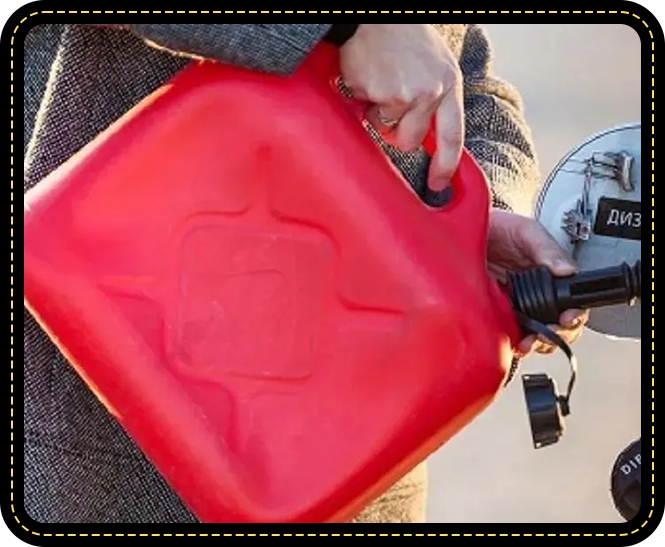 A person holding a red gas can.